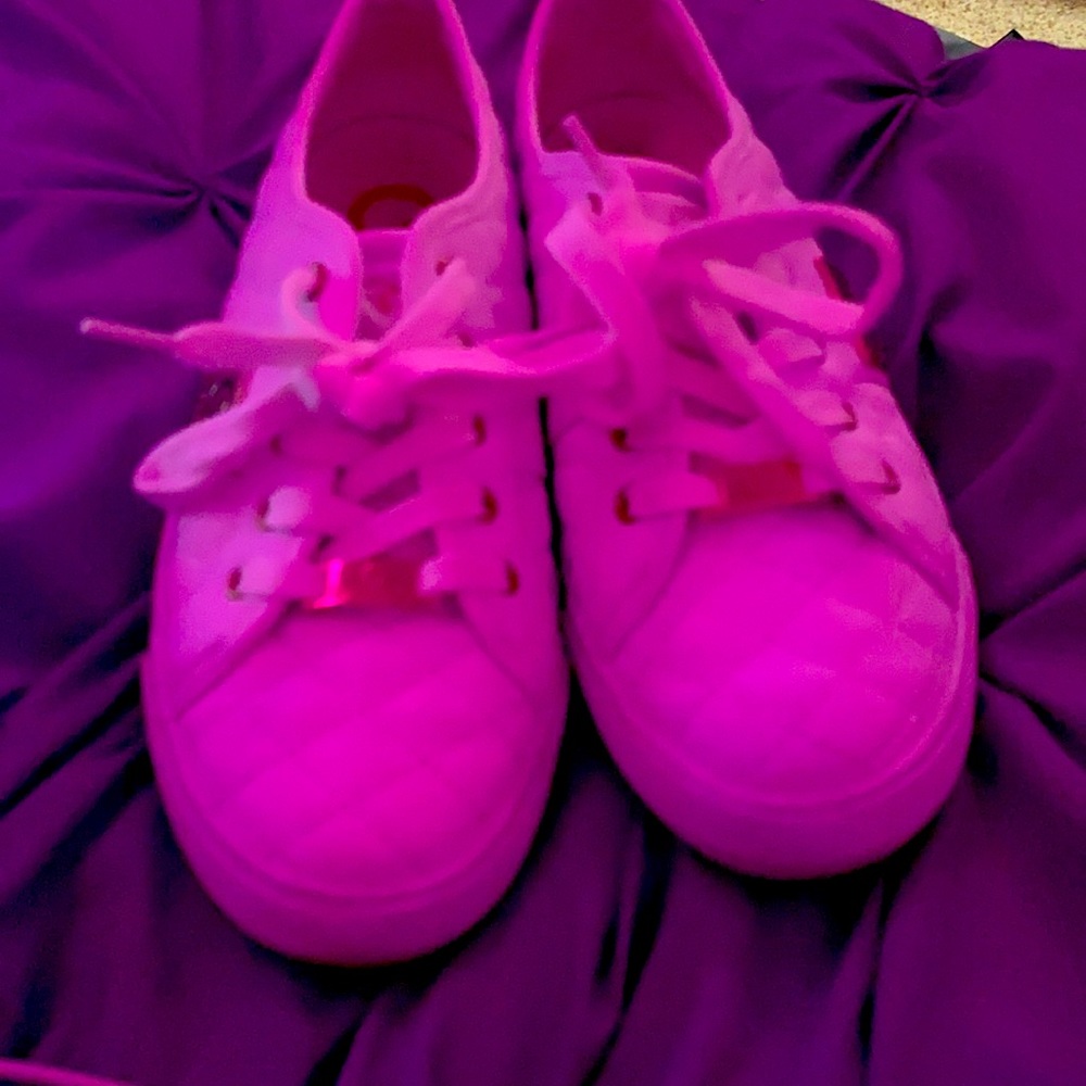 White and gold guess shoes.